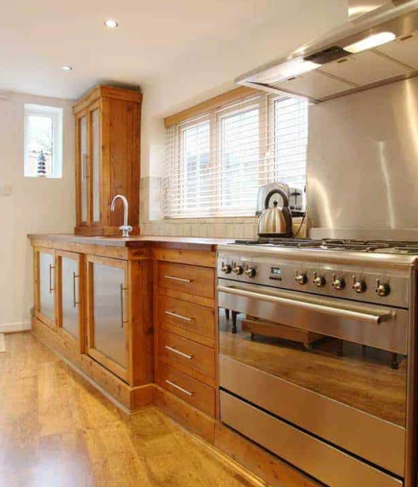 Country-style kitchen complemented with an oak floor