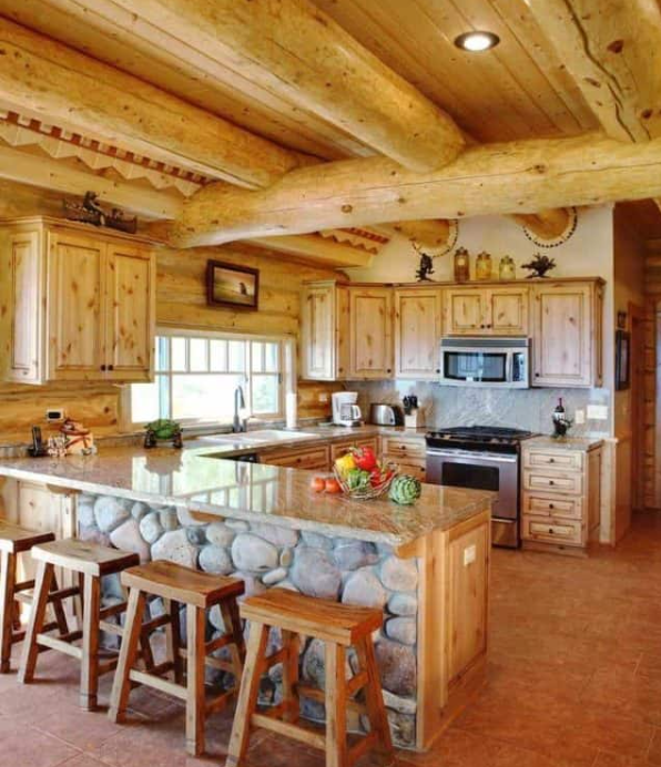 Rustic Kitchen making use of stone and wooden logs for a primitive style feel