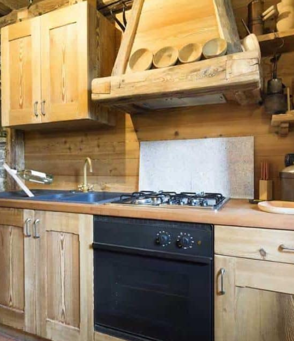 Primitive cabin kitchen with stone walls
