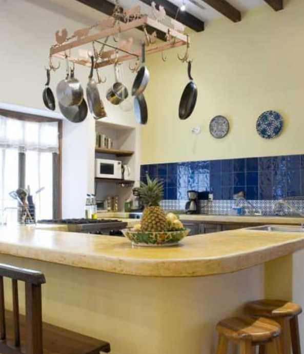 Simple country kitchen with dedicated island combining blue and cream