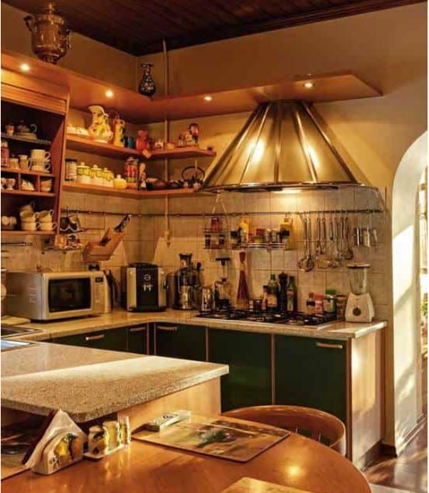 A compact well-lit farmhouse kitchen in a country home