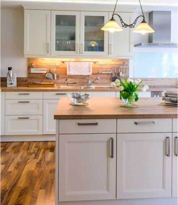 White-themed rustic kitchen with hardwood floors